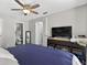 Bedroom with en suite bathroom, tiled floors, and ceiling fan at 1400 Gandy N Blvd # 809, St Petersburg, FL 33702