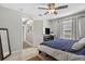 Bedroom with tiled floor, ceiling fan, and walk-in closet at 1400 Gandy N Blvd # 809, St Petersburg, FL 33702