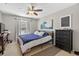 A bedroom with a ceiling fan, tiled floor, and large painting on the wall at 1400 Gandy N Blvd # 809, St Petersburg, FL 33702
