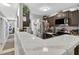 This open kitchen offers stone countertops, stainless steel appliances and a bar for gathering at 1400 Gandy N Blvd # 809, St Petersburg, FL 33702
