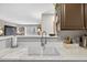 Bright kitchen with an undermount sink and breakfast bar overlooking the living area at 1400 Gandy N Blvd # 809, St Petersburg, FL 33702