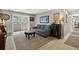 Comfortable living room with neutral tones, sliding glass door, and stylish furnishings at 1400 Gandy N Blvd # 809, St Petersburg, FL 33702