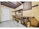 View of the unfinished basement, showing an access door and a work bench at 1402 E Mimosa Dr, Plant City, FL 33563