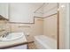 Bathroom featuring a vanity, sink, and tiled walls, providing a functional and clean space at 1402 E Mimosa Dr, Plant City, FL 33563