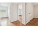 Hallway with hardwood floors that connect the bedrooms at 1402 E Mimosa Dr, Plant City, FL 33563