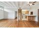 Open floor plan featuring hardwood floors and an open kitchen at 1402 E Mimosa Dr, Plant City, FL 33563