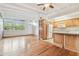 Open floor plan with hardwood floors featuring kitchen at 1402 E Mimosa Dr, Plant City, FL 33563