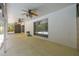 Spacious covered patio with ceiling fans, providing a comfortable transition from indoor to outdoor living at 1402 E Mimosa Dr, Plant City, FL 33563