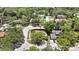 Beautiful aerial view showcasing the home's location within a lush, green neighborhood with tree-lined streets at 14619 Daybreak Dr, Lutz, FL 33559