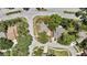 Aerial view of a single-Gathering home with mature trees and a well-maintained yard, outlined in red at 14619 Daybreak Dr, Lutz, FL 33559