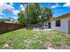Backyard featuring new fence, patio and well-maintained lawn at 14619 Daybreak Dr, Lutz, FL 33559