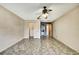 Bedroom with tile flooring, ceiling fan, closet, and neutral wall paint at 14619 Daybreak Dr, Lutz, FL 33559