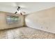 Bedroom with tile flooring, ceiling fan, and a window overlooking the yard at 14619 Daybreak Dr, Lutz, FL 33559
