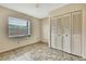 Bedroom includes a window, tile flooring and closet with louvered doors at 14619 Daybreak Dr, Lutz, FL 33559
