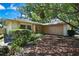 Charming single-story home with a brick facade and lush landscaping, offering great curb appeal at 14619 Daybreak Dr, Lutz, FL 33559