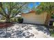 Charming single-story home featuring an attached two-car garage and mature shade trees in the front yard at 14619 Daybreak Dr, Lutz, FL 33559