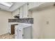 Kitchen with ample cabinet space, under cabinet lighting, and tile backsplash at 14619 Daybreak Dr, Lutz, FL 33559