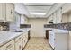 Functional kitchen featuring classic cabinetry, sleek countertops, and tiled backsplash at 14619 Daybreak Dr, Lutz, FL 33559