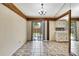 Bright kitchen with a sliding glass door to the backyard and white cabinetry at 14619 Daybreak Dr, Lutz, FL 33559