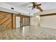 Inviting living room with an open layout, showcasing tile flooring and access to other areas of the home at 14619 Daybreak Dr, Lutz, FL 33559
