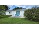 Cozy backyard patio with seating area, perfect for outdoor relaxation and entertaining guests at 1583 Eunice Ln, Clearwater, FL 33756