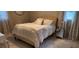Bedroom featuring a plush bed and elegant decor at 1583 Eunice Ln, Clearwater, FL 33756