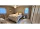 Bright bedroom with a well-lit space, neutral colors, tile floor, and large window views at 1583 Eunice Ln, Clearwater, FL 33756