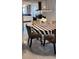 Bright dining area featuring a modern chandelier, marble floors, and views into the kitchen at 1583 Eunice Ln, Clearwater, FL 33756