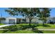 Charming single-story home with a well-maintained lawn and mature tree providing ample shade at 1583 Eunice Ln, Clearwater, FL 33756