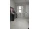 Stylish living area with sleek marble floors, elegant decor, and bright natural light at 1583 Eunice Ln, Clearwater, FL 33756