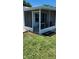 Cozy screened patio offering an inviting space for relaxation and outdoor dining at 1583 Eunice Ln, Clearwater, FL 33756