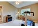 Simple bedroom layout featuring a ceiling fan, window, and workout equipment at 1827 Foxboro Ct, Oldsmar, FL 34677