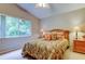 Cozy bedroom with large window offering a peaceful green view at 1827 Foxboro Ct, Oldsmar, FL 34677