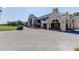 Clubhouse exterior showcasing ample parking, lush landscaping, and inviting patio at 1827 Foxboro Ct, Oldsmar, FL 34677