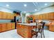 Large kitchen with an island, stainless steel appliances, and wooden cabinets at 1827 Foxboro Ct, Oldsmar, FL 34677