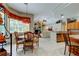 Open-concept dining area with adjacent kitchen and views of the living room at 1827 Foxboro Ct, Oldsmar, FL 34677