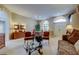 Inviting living room featuring a seating area, archways, and a dining table creating a warm and welcoming atmosphere at 1827 Foxboro Ct, Oldsmar, FL 34677