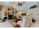 Comfortable living room featuring a fireplace, built-in shelving, and plush seating, perfect for relaxation at 1827 Foxboro Ct, Oldsmar, FL 34677