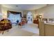 Open-concept living room featuring a plush sofa, elegant decor, and archways leading to other rooms at 1827 Foxboro Ct, Oldsmar, FL 34677
