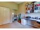Spacious office featuring neutral walls, built-in desk with shelving, and a cozy reading nook at 1827 Foxboro Ct, Oldsmar, FL 34677