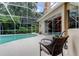 This screened-in pool has a tanning ledge and is perfect for relaxing in privacy at 1827 Foxboro Ct, Oldsmar, FL 34677