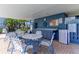 Outdoor pool area with tables, chairs and posted pool rules at 1827 Foxboro Ct, Oldsmar, FL 34677