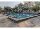 Clean and inviting swimming pool with lane markers and deck chairs, perfect for exercise at 1827 Foxboro Ct, Oldsmar, FL 34677