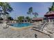 Inviting pool area with lounge chairs and shaded seating for relaxation at 1827 Foxboro Ct, Oldsmar, FL 34677
