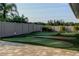 Backyard putting green with flags and undulating surfaces for golf enthusiasts at 1827 Foxboro Ct, Oldsmar, FL 34677