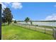 A well-maintained backyard with a serene lake view, offering a peaceful retreat for relaxation and outdoor enjoyment at 19209 Long Lake Ranch Blvd, Lutz, FL 33558