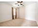 Bedroom with neutral carpet, ceiling fan, and ample natural light at 19209 Long Lake Ranch Blvd, Lutz, FL 33558