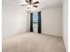 Bedroom featuring a ceiling fan, window with blind and neutral carpet flooring at 19209 Long Lake Ranch Blvd, Lutz, FL 33558