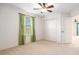 Bedroom with carpet flooring, window with curtains, ceiling fan and double door closet at 19209 Long Lake Ranch Blvd, Lutz, FL 33558