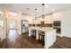Bright kitchen featuring white cabinets, stainless steel appliances, and a center island with seating at 19209 Long Lake Ranch Blvd, Lutz, FL 33558